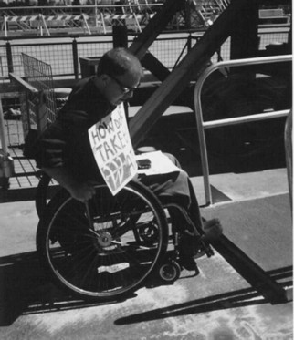 photo of Alexander in a wheelchair meets steps to a ferry