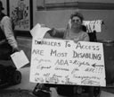 photo of Luda demonstrating for accessible taxis