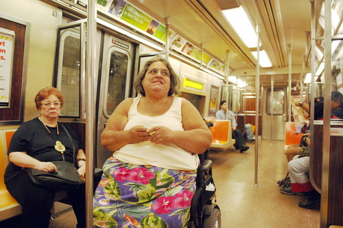 Edith Prentiss inside a subway train while in her wheelchair